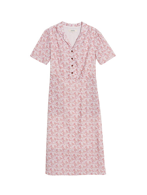 Flat lay of a pink floral cottagecore dress with short sleeves and wooden buttons, styled for a feminine and casual everyday look.