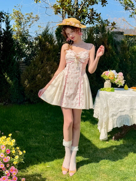 Romantic coquette floral mini dress with lace trim, bow detail, and puffed eyelet skirt. Perfect for a dreamy summer look, featuring a playful, vintage-inspired silhouette ideal for garden parties and feminine aesthetics.