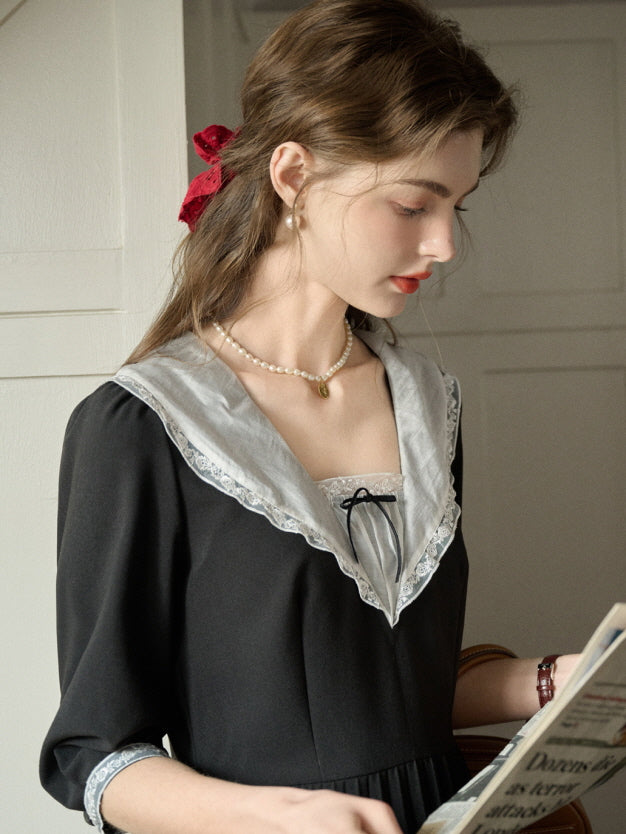 A dreamy retro outfit featuring a black dress with delicate lace details, captured in a casual and beautiful moment full of fairytale charm.