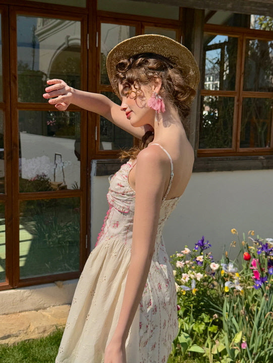 Side view of a romantic coquette floral mini dress with lace trim and ribbon bow detail. Feminine summer look with delicate floral embroidery and vintage-inspired charm, perfect for garden outings and dreamy days.