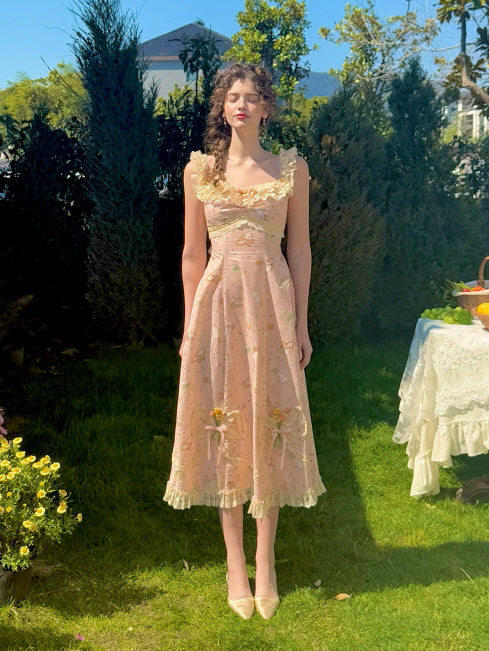 Romantic floral lace dress with delicate ruffle straps and vintage-inspired floral embroidery, captured in a sunlit garden setting