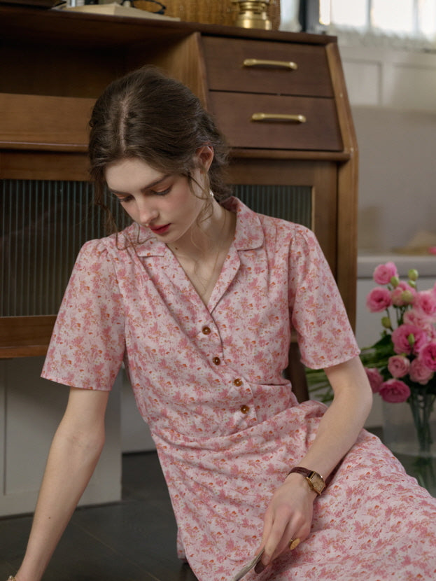 A relaxed moment in a cottagecore pink floral dress with wooden buttons, captured in a cozy and casual vintage-inspired interior.