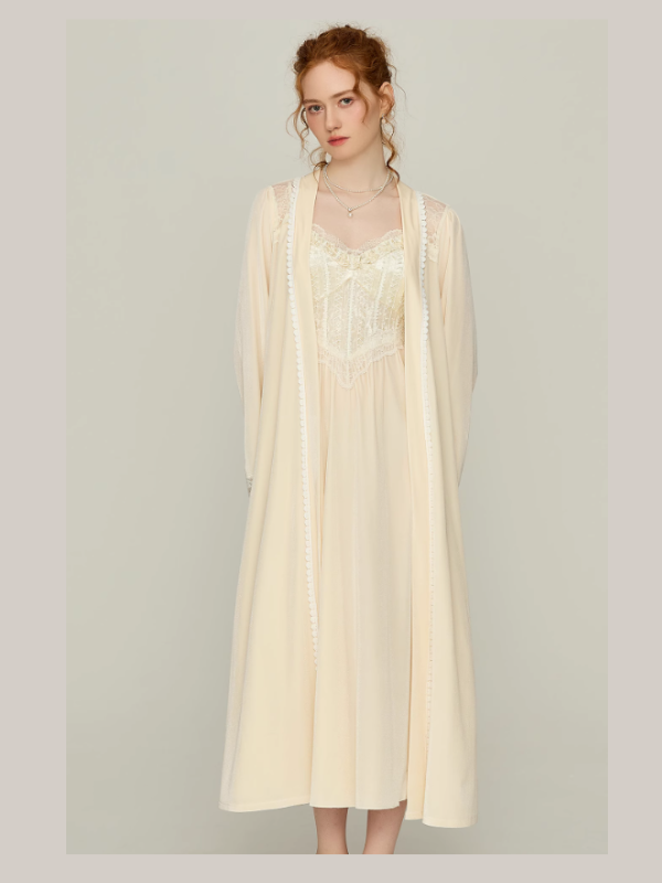 Model wearing an ivory lace corset-style slip nightgown with delicate straps and a flowing skirt, romantic princess aesthetic loungewear for bridal-inspired sleepwear.