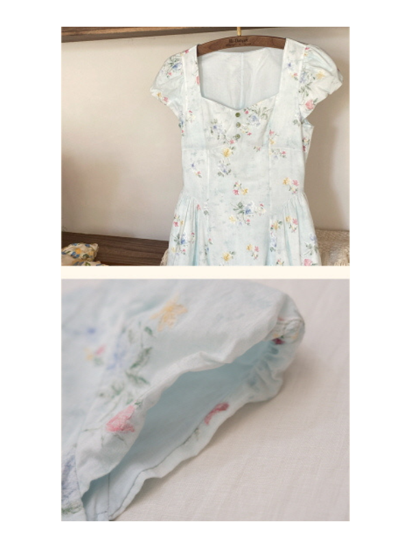 Close-up of a vintage floral dress with cap sleeves and sweetheart neckline, highlighting the delicate button-down front and soft pastel floral pattern, styled on a wooden hanger for a charming, cottagecore aesthetic.