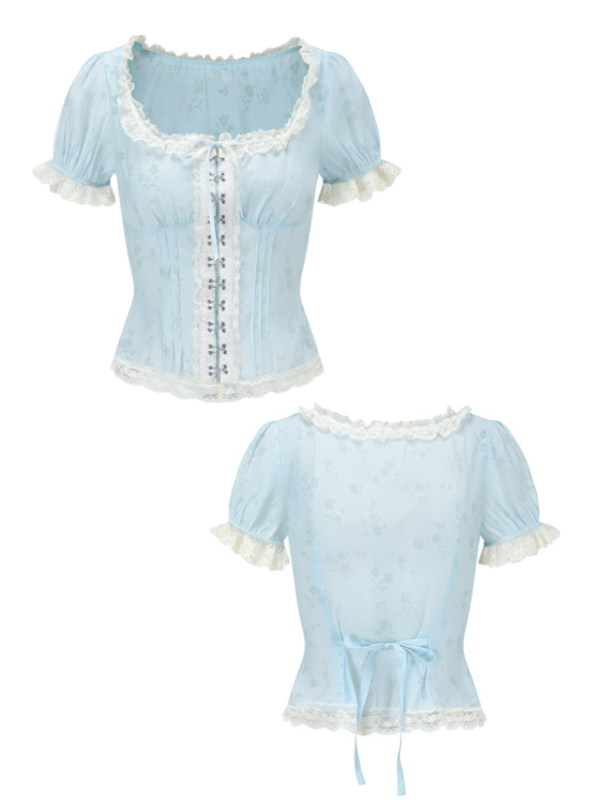 Front and back view of a pastel blue floral corset top featuring lace trim, puff sleeves, and lace-up detailing. The back includes a delicate ribbon tie for an adjustable fit, highlighting its vintage-inspired design.