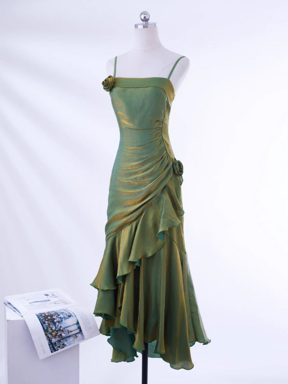 Close-up of silk-like green dress showing rose appliqué and side pleats, perfect for fairytale dress or prom party dress.