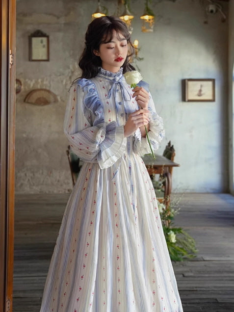 A dreamy fantasy outfit featuring a romantic striped dress with ruffled accents, evoking a vintage and fairytale aesthetic.