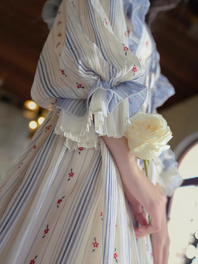 Close-up of a fairytale-inspired vintage dress with delicate pleated cuffs and floral stripe pattern, creating a soft aesthetic outfit.