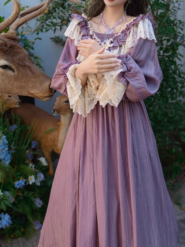 Fairytale vintage aesthetic dress in soft purple, featuring a smocked bodice and layered lace ruffles, styled in a fantasy garden setting with deer statues.