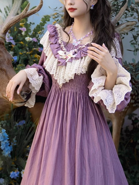 Close-up of a vintage purple dress with delicate lace ruffles and a shirred waist, worn by a woman posing gracefully near a deer, evoking a soft fantasy fairytale mood.