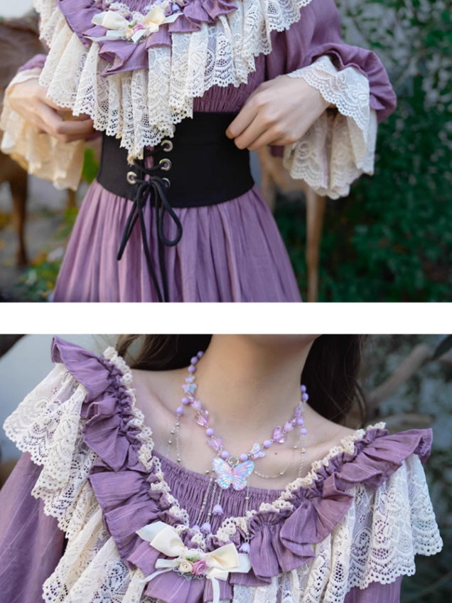 Close-up of a fairytale-style purple dress with lace ruffles and a black ribbon corset belt, paired with a pastel butterfly necklace, creating a dreamy vintage fantasy outfit.
