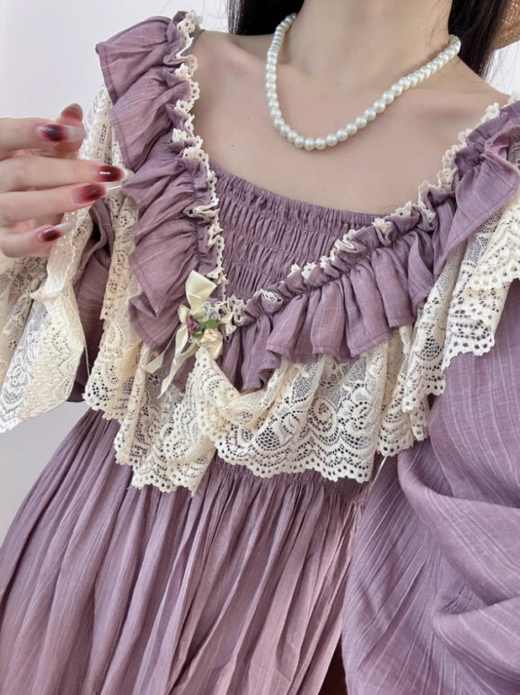 Close-up of a fairytale-inspired purple vintage dress featuring ruffled details and ivory lace trim, worn with a pearl necklace for a fantasy aesthetic.
