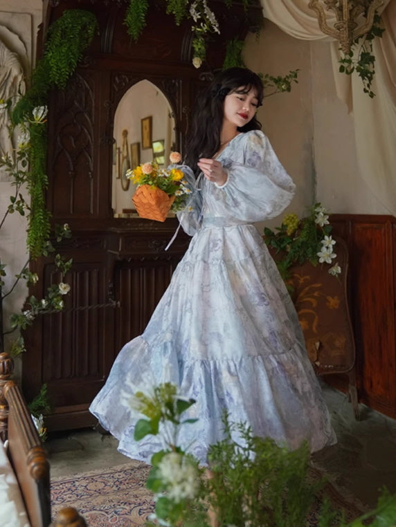A romantic lavender gown with tiered ruffles and delicate floral patterns, styled with a woven basket of flowers for a whimsical, fairytale aesthetic.