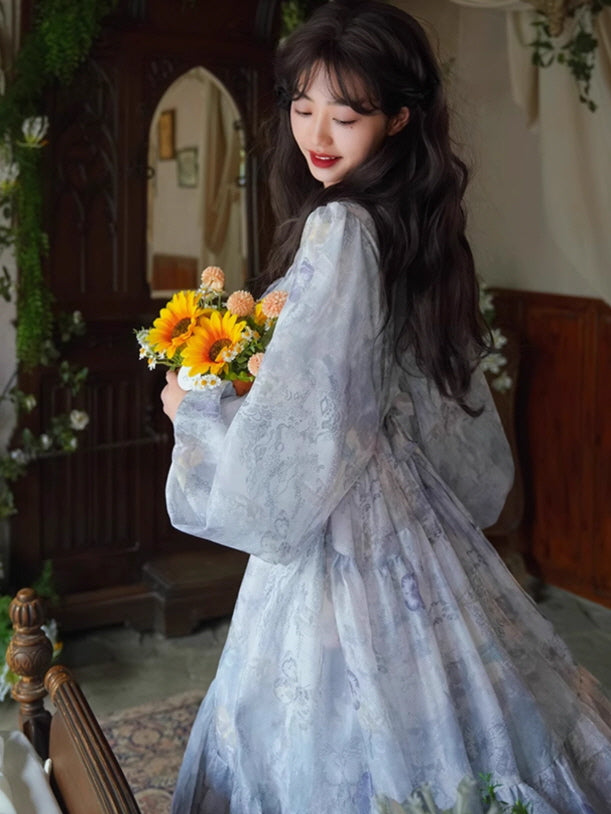 Side view of a dreamy lavender floral dress with voluminous sleeves and a gathered waist, styled with a bouquet of sunflowers for a romantic fairycore look.