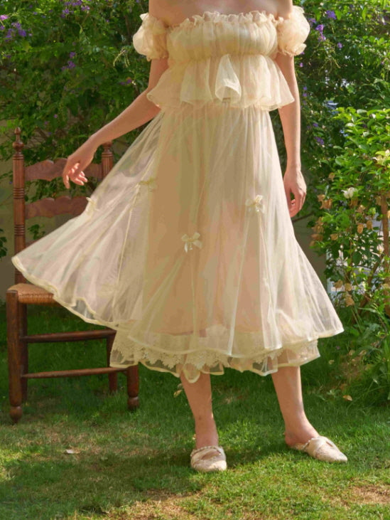 Close-up of a layered tulle skirt with lace trim and soft ribbon bows, capturing the essence of a romantic princesscore aesthetic outfit.