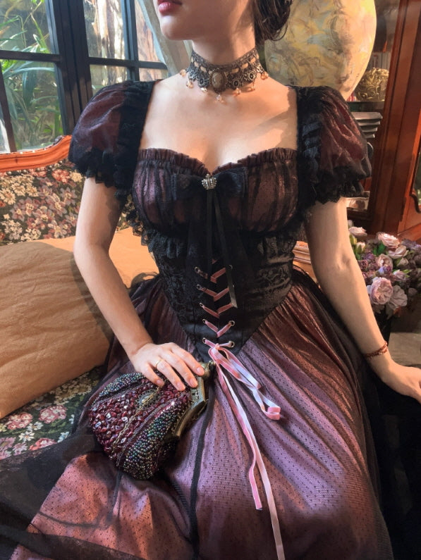 Close-up of a Romantic Fairytale lace-up corset dress featuring black lace details, sheer puff sleeves, and a deep wine tulle skirt, styled as a vintage princesscore coquette aesthetic outfit.