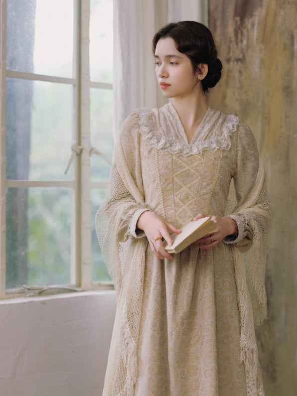 Woman wearing a vintage-inspired cream lace dress with corset details, standing by a bright window while holding an open book, cottagecore fairytale aesthetic.