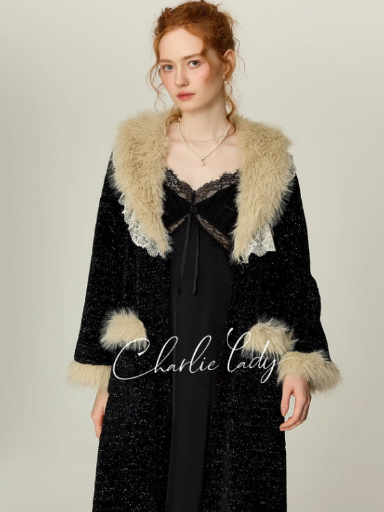 Model wearing a black lace slip nightgown with a long faux fur trim robe, vintage princesscore loungewear look with soft winter glamour.