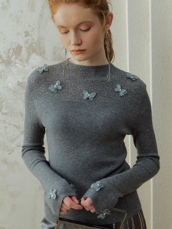 Grey butterfly knit top featuring subtle texture and soft appliqué details, styled as a romantic fairycore outfit with a vintage-inspired winter mood.