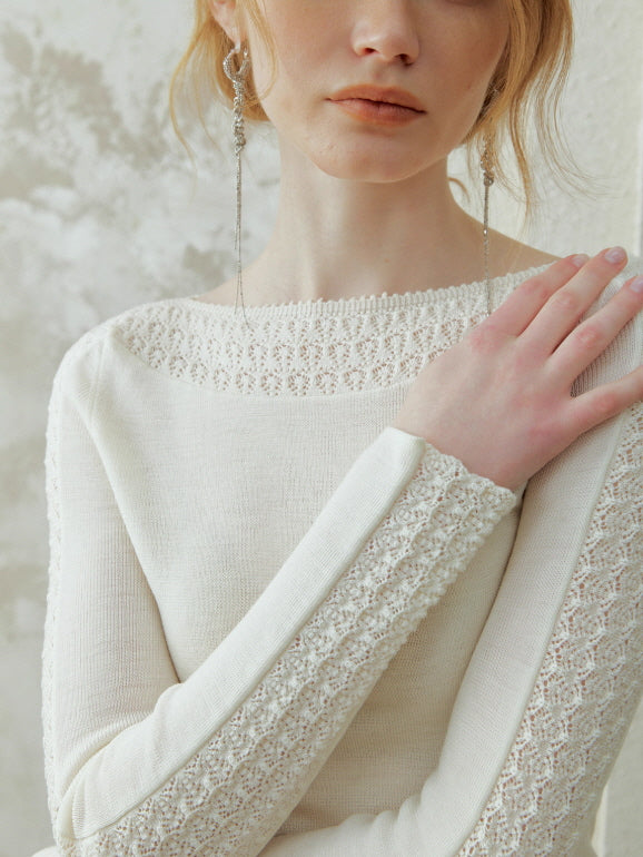 Close-up of an ivory lace trim knit top showcasing delicate shoulder and sleeve details, perfect for a romantic fairycore and vintage-inspired outfit.