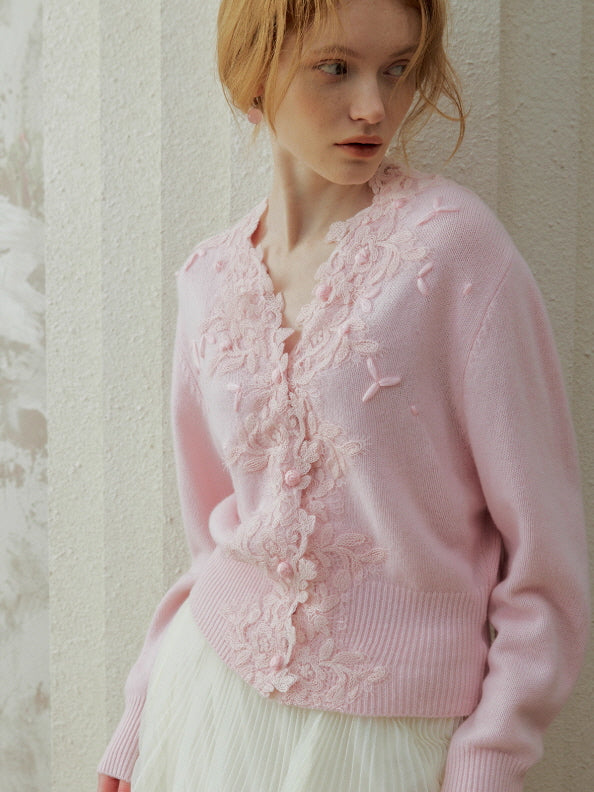 Soft pink lace embroidered cardigan featuring floral appliqué and button front, styled with a flowing skirt for a feminine fairycore and vintage-inspired outfit.