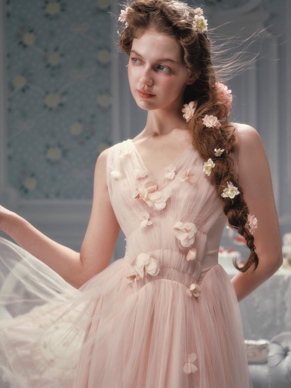 Romantic blush tulle dress featuring three-dimensional floral appliqués and a soft V neckline, styled in a vintage-inspired fairycore and princesscore aesthetic outfit.