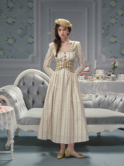 Romantic vintage floral dress with a corset-style waist and lace-trimmed neckline, featuring a soft cream floral print, long sleeves, and a flowing skirt, styled in a cottagecore fairytale interior.