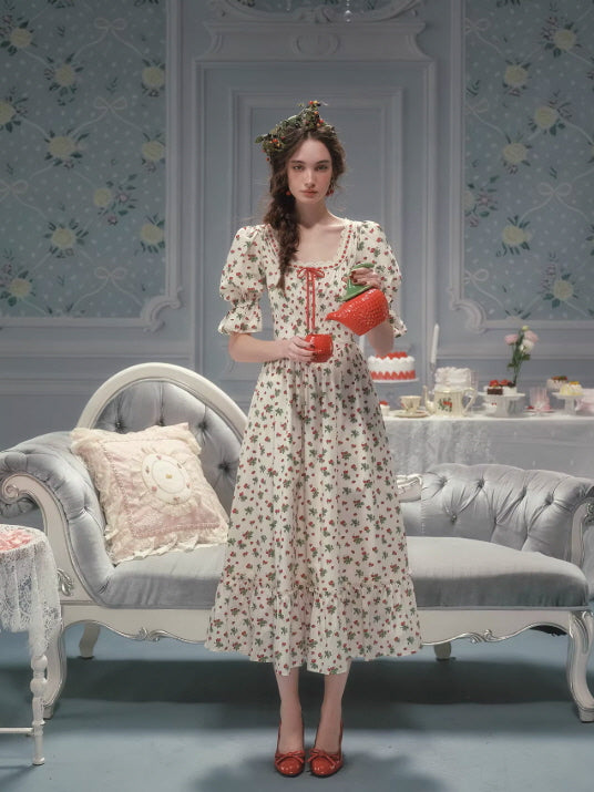 Romantic strawberry floral dress with puff sleeves and a flowing vintage silhouette, styled in a soft cottagecore fairytale interior with a gentle, nostalgic mood.