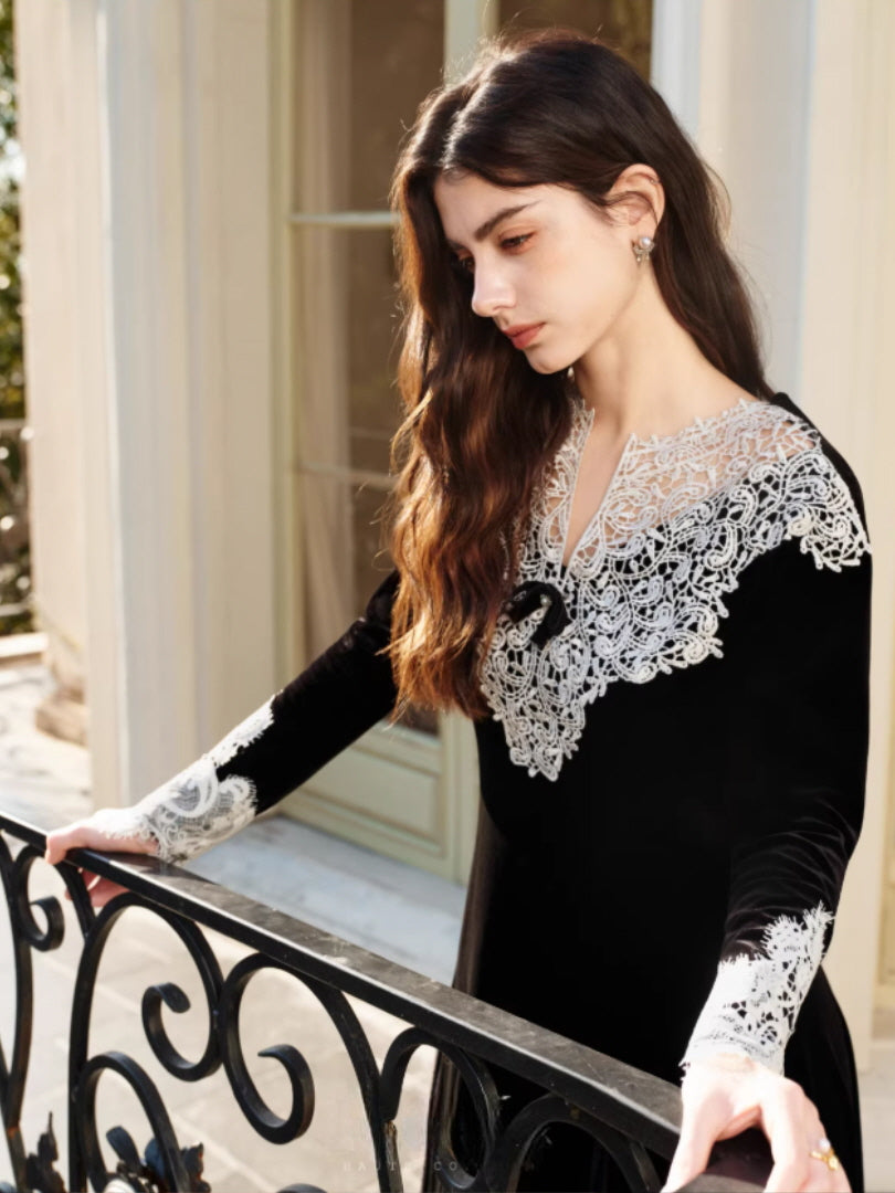 Vintage-inspired black lace dress featuring a delicate ribbon detail at the neckline and flowing silhouette, creating a soft fairytale and classic romantic atmosphere.
