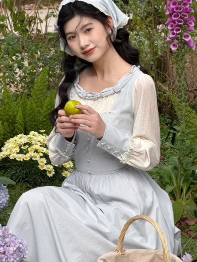 Romantic prairie style grey dress with lace neckline and chiffon sleeves, vintage cottagecore feminine dress in garden setting