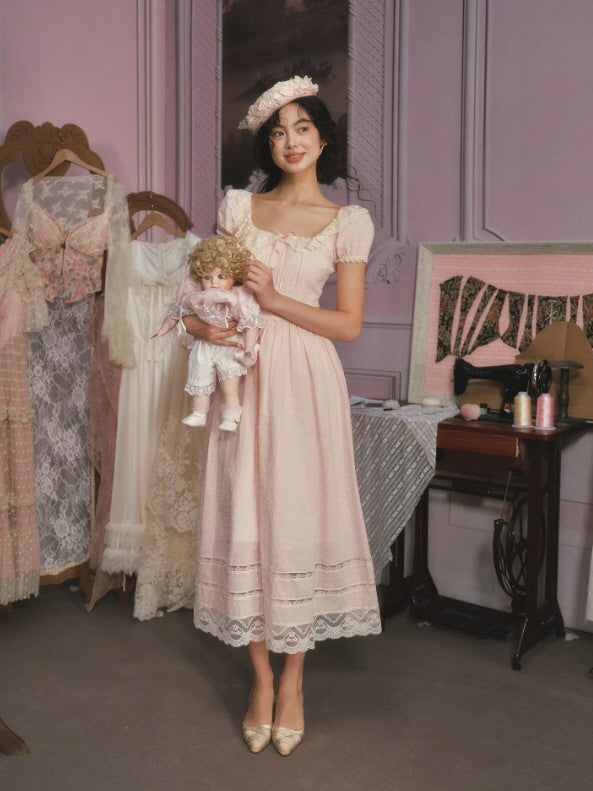 Soft pink cottagecore midi dress with lace trim and puff sleeves, styled in vintage romantic bedroom setting