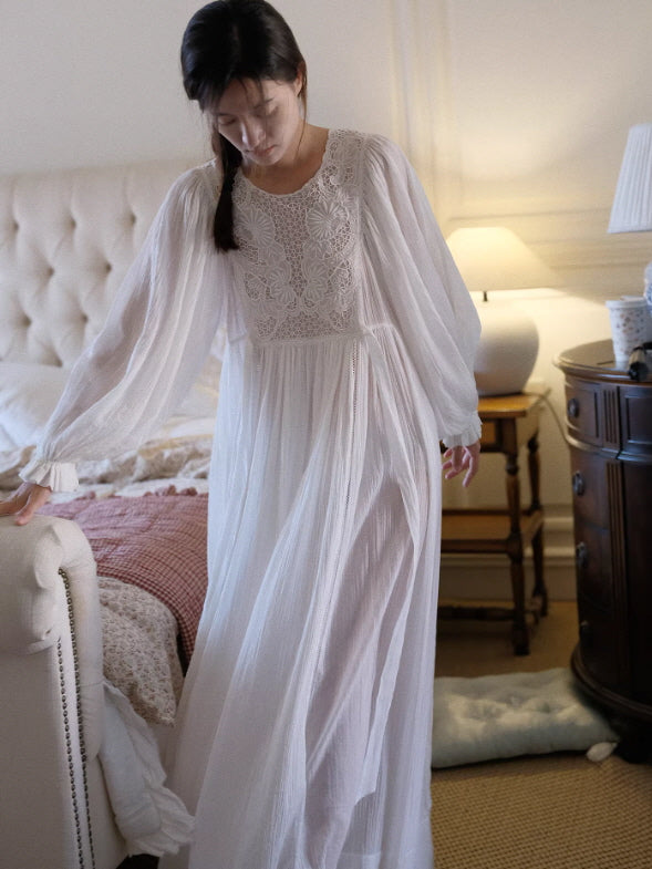 Flowy white cottagecore nightdress in bedroom setting, sheer long sleeves and relaxed romantic silhouette