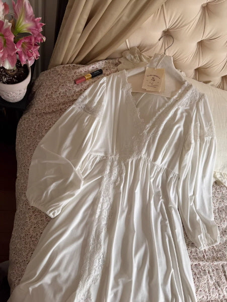 Vintage-inspired white cotton nightdress laid on bed with delicate lace details, cottagecore aesthetic and soft natural lighting