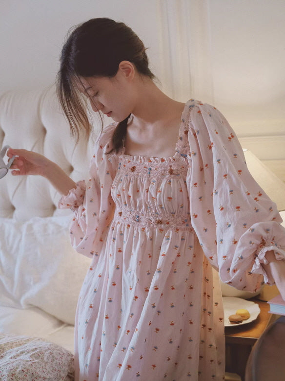 Flowy pink cottagecore nightgown with gathered bust and long sleeves, relaxed morning mood with warm natural lighting