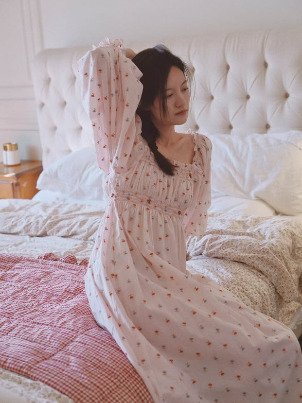 Soft pink floral nightgown with smocked bodice and puff sleeves, romantic cottagecore sleepwear in cozy bedroom setting
