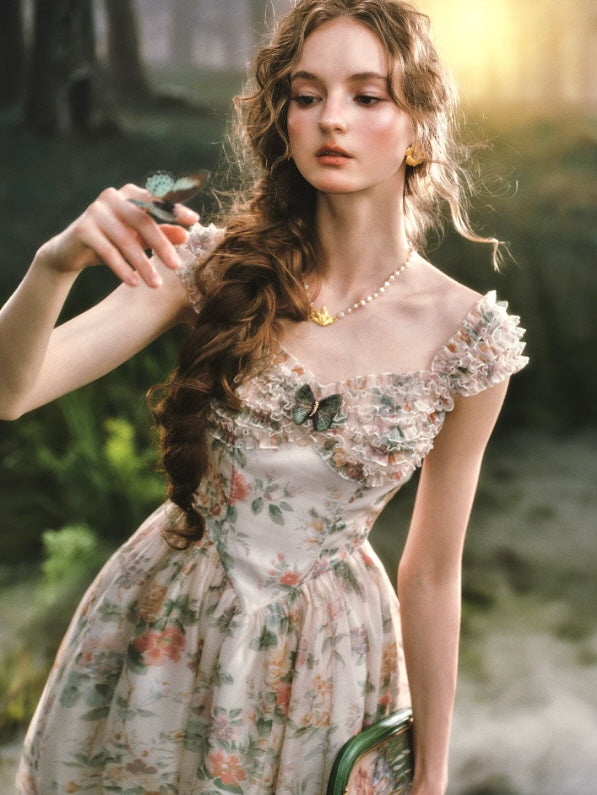 soft pastel floral dress with romantic neckline and butterfly embellishment styled in enchanted forest light