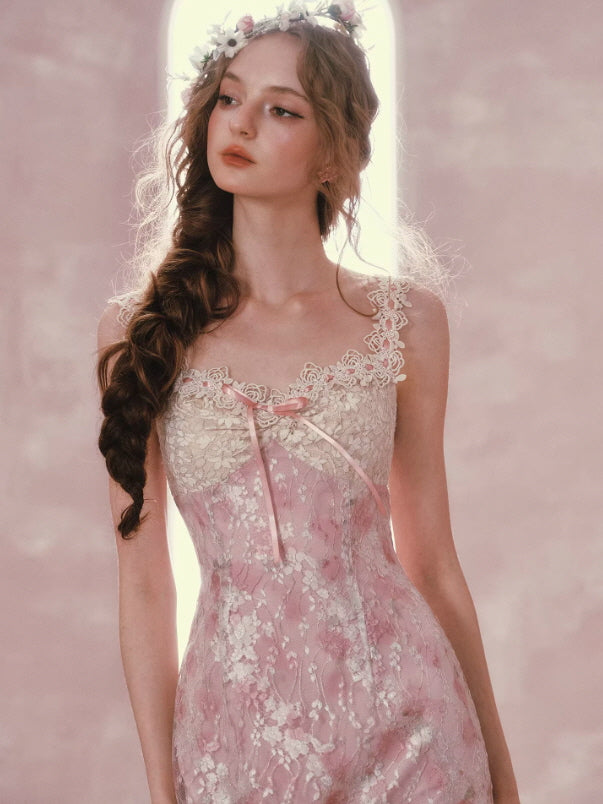 Close-up of pink lace cottagecore dress featuring delicate floral embroidery, ribbon detail and sheer neckline, soft feminine vintage style