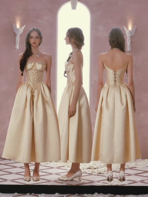 Gold satin corset dress front side back view, lace-up back detail and structured princess silhouette