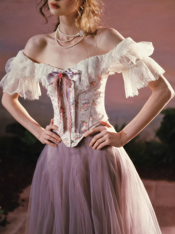 Vintage floral corset with lace trim and bow detail, soft romantic fairycore aesthetic close-up