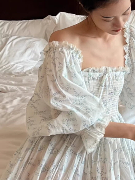 soft blue floral cottagecore dress with puff sleeves, square neckline smocked bodice detail