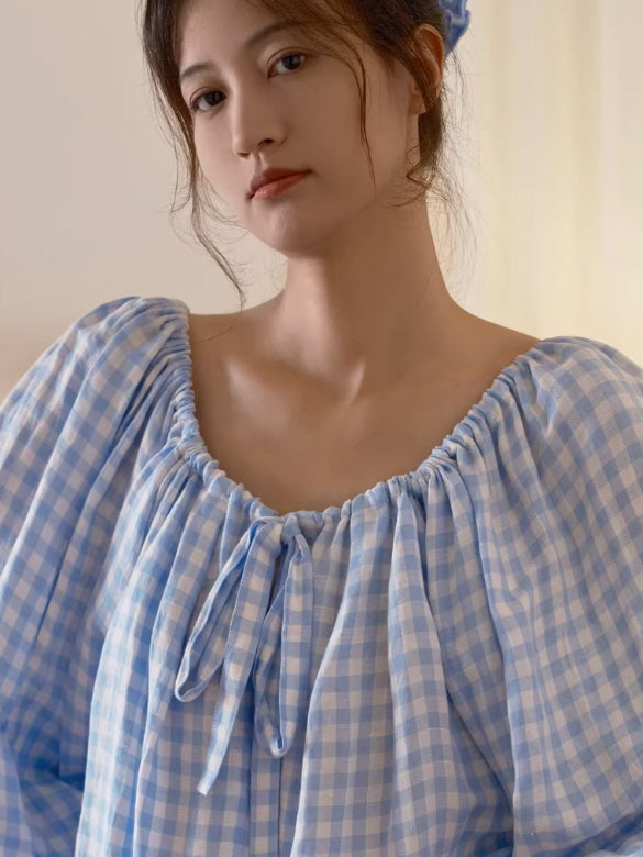 close up blue check blouse with elastic neckline and bow detail soft feminine loungewear
