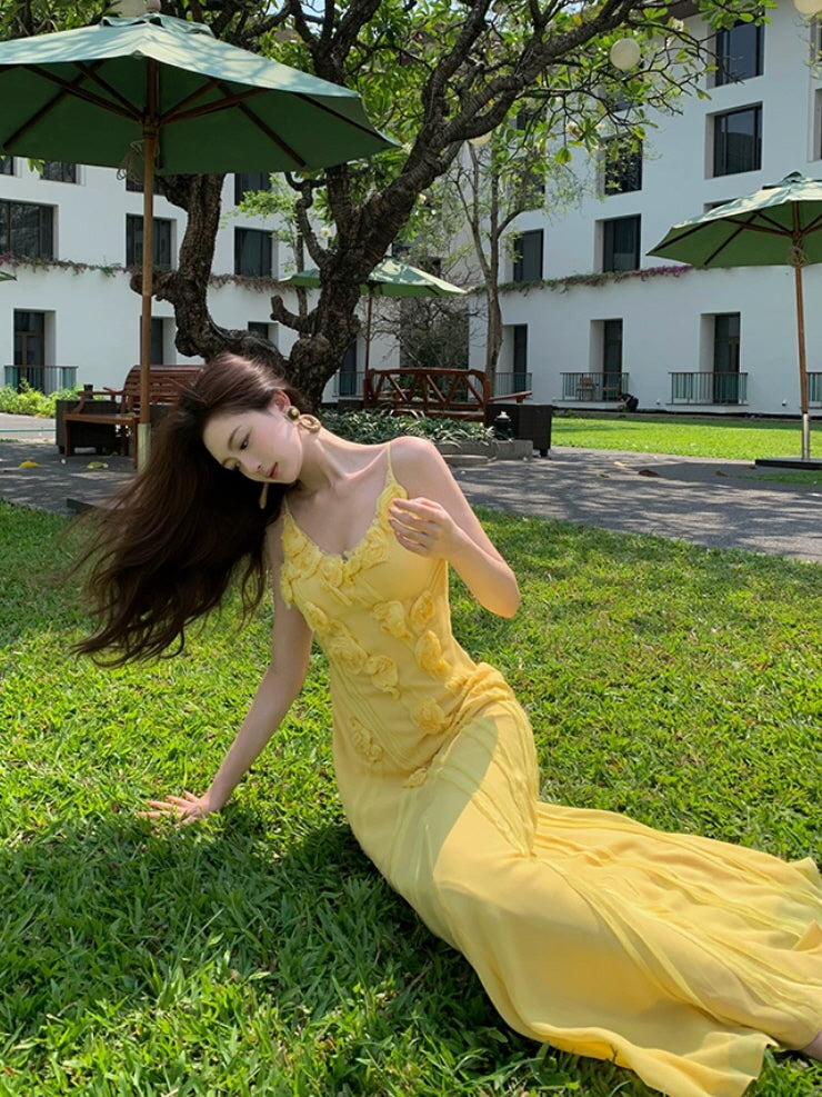 Yellow floral fairycore dress with 3D rose appliques on a sunny lawn