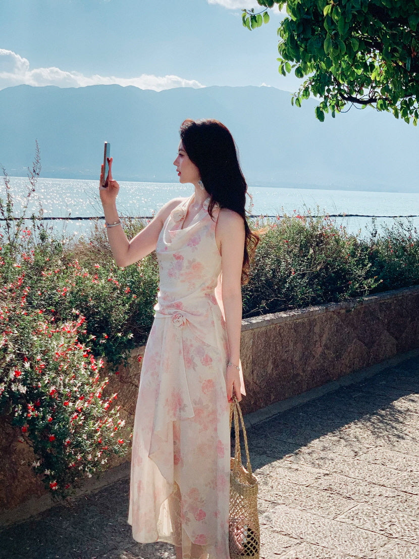 Dreamy pink fairycore halter dress with soft floral print and seaside vacation styling