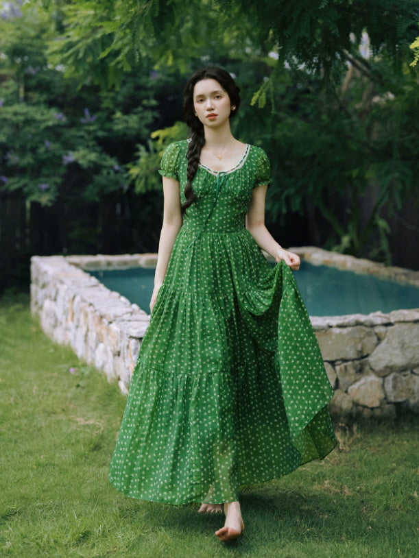 Emerald green floral maxi dress with gathered bodice and short puff sleeves