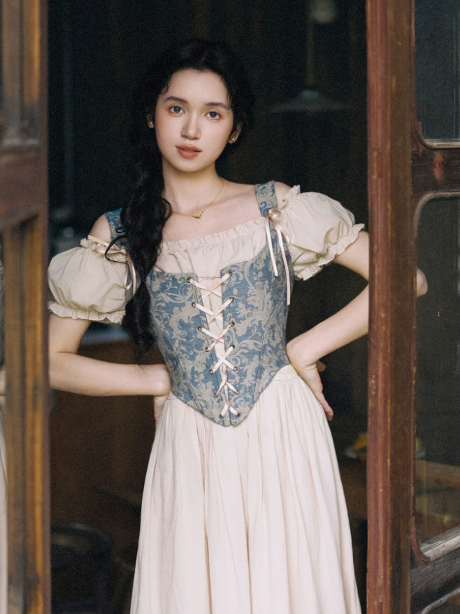 Vintage inspired prairie dress with a blue tapestry corset bodice, ribbon lace up front and soft puff sleeves