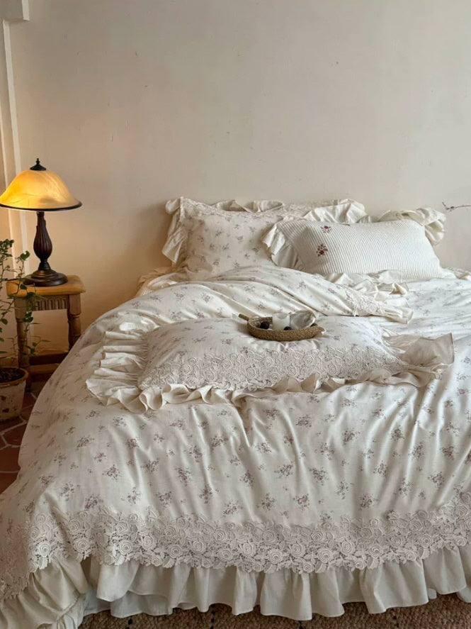 Romantic cottagecore bedding set with tiny floral print, scalloped lace trim, and soft ivory ruffles in a cozy vintage bedroom