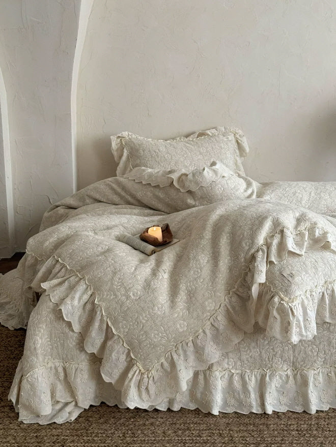 Vintage cottagecore bed set with ivory floral embroidery and cascading ruffle trim