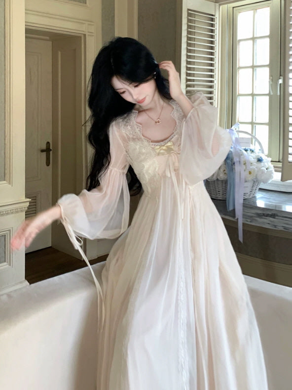 Vintage inspired cream lace nightgown with flowing long skirt, sheer sleeves and feminine ribbon details
