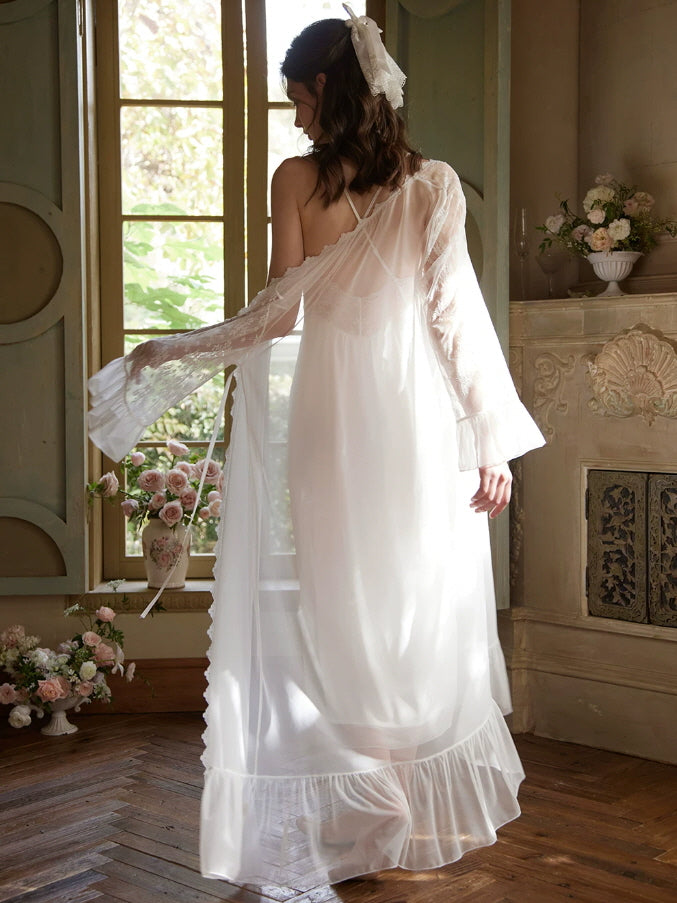 Back view of white lace nightgown with crisscross straps and flowing ankle length silhouette