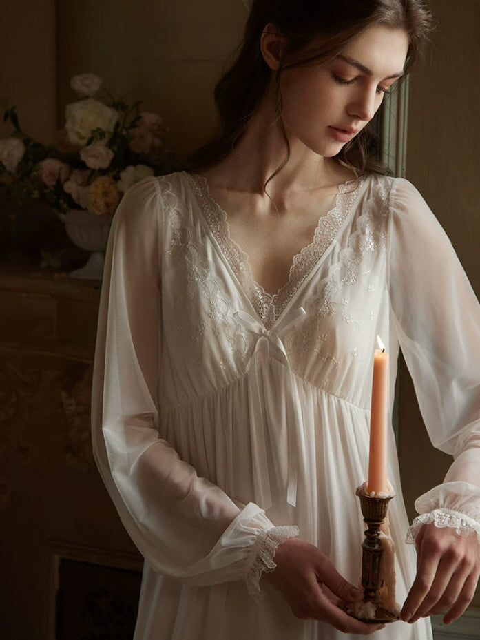 Flowing white lace nightgown with empire waist, sheer sleeves and romantic cottagecore style